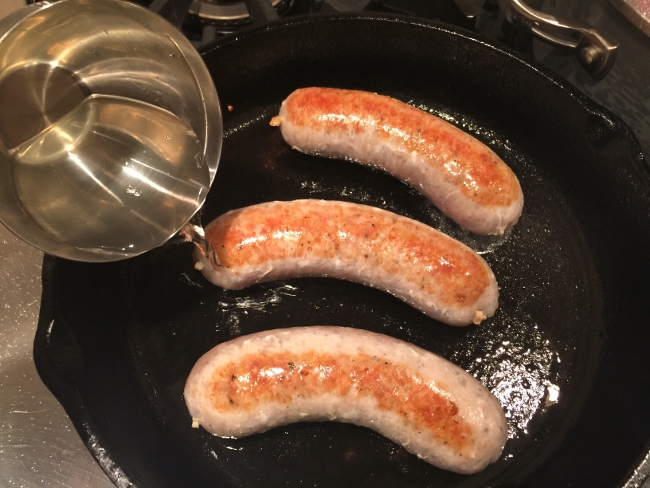 bratwursts-on-pretzel-buns-with-sauteed-mustard-red-cabbage-014-650x488