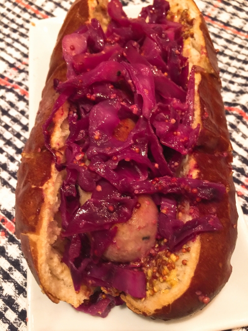 bratwursts-on-pretzel-buns-with-sauteed-mustard-red-cabbage-041-488x650